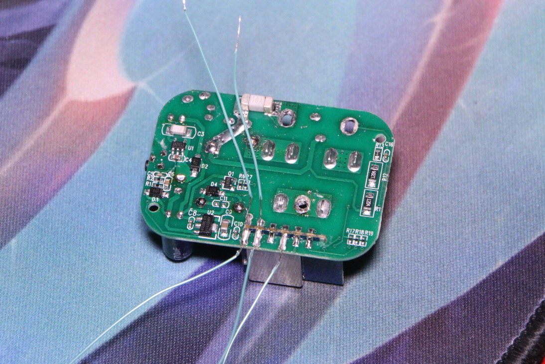 Bottom of circuit board with five fine wires soldered on